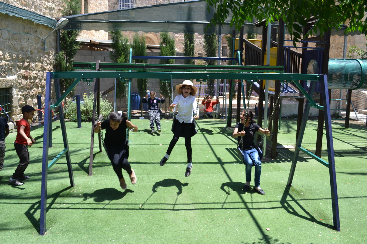 Kids play in Friendship Garden, Hebron old city (David Kattenburg)