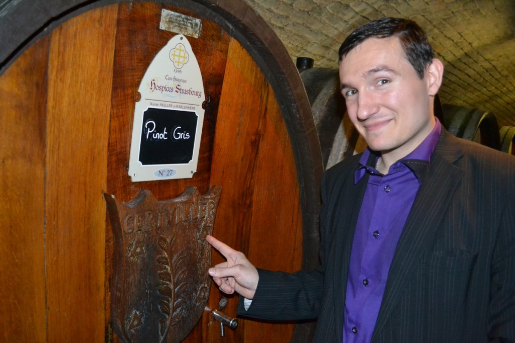 Thibaut Baldinger in front of one of the cellar's wine casks